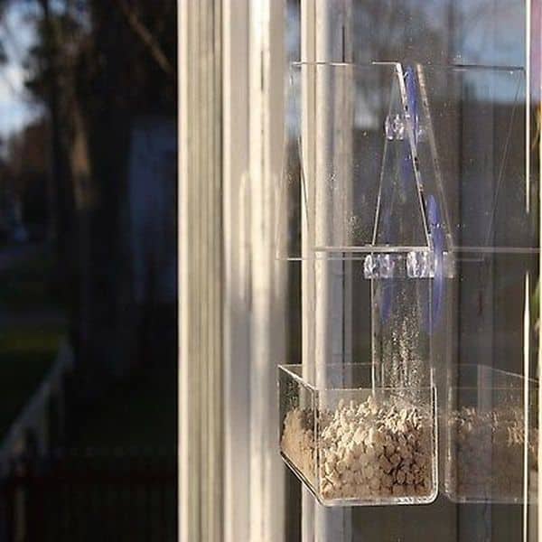 Прозрачная кормушка для птиц в виде домика